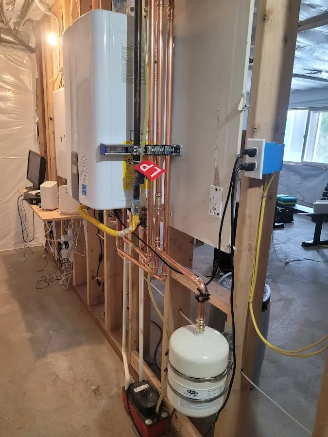 Licensed plumber repairing a kitchen sink in Stevensville